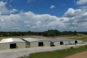 four warehouses in an open space